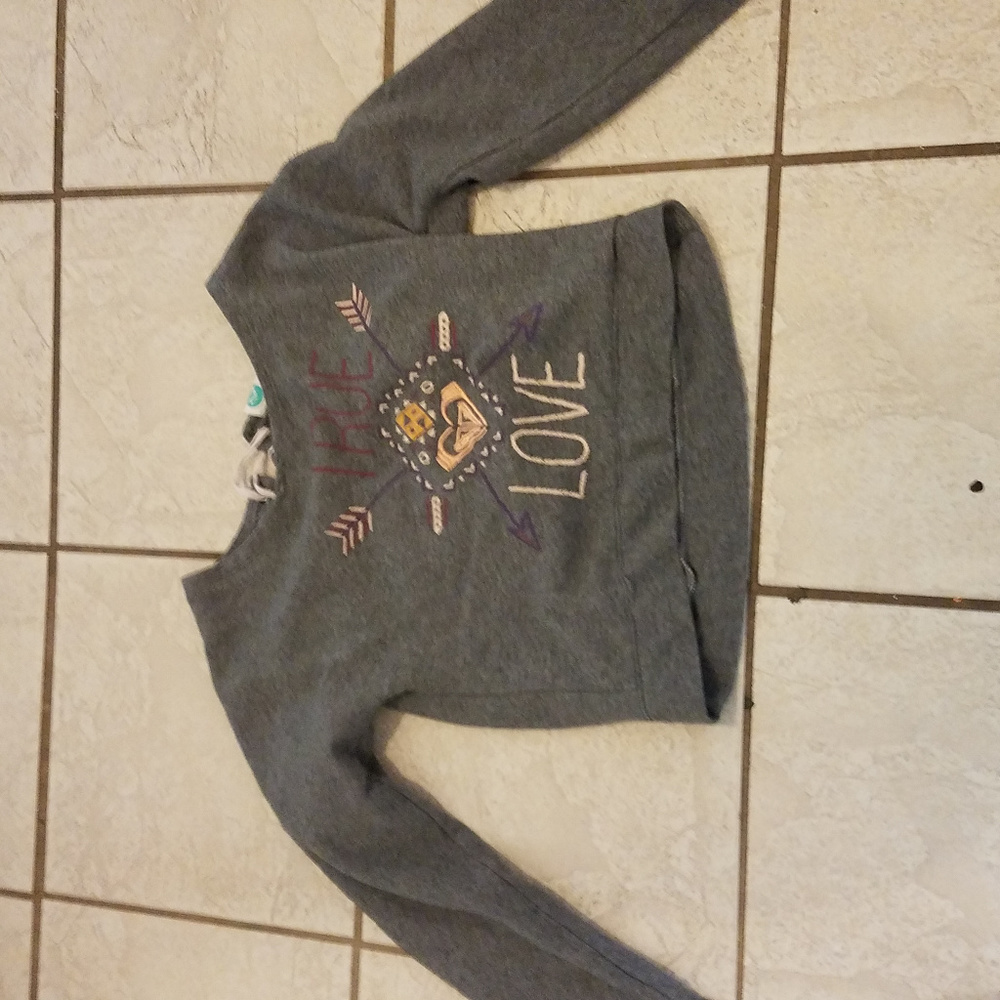a shirt with lace on the back